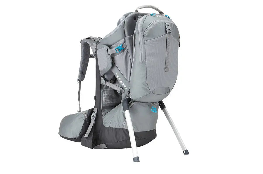 Thule Sapling Elite Child Carrier in grey with blue accents, stand legs extended for stable setup.