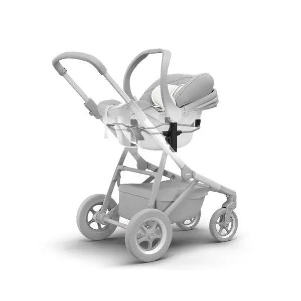 Thule Sleek Car Seat Adapter in black attached to a Thule Sleek stroller, securing an infant car seat.