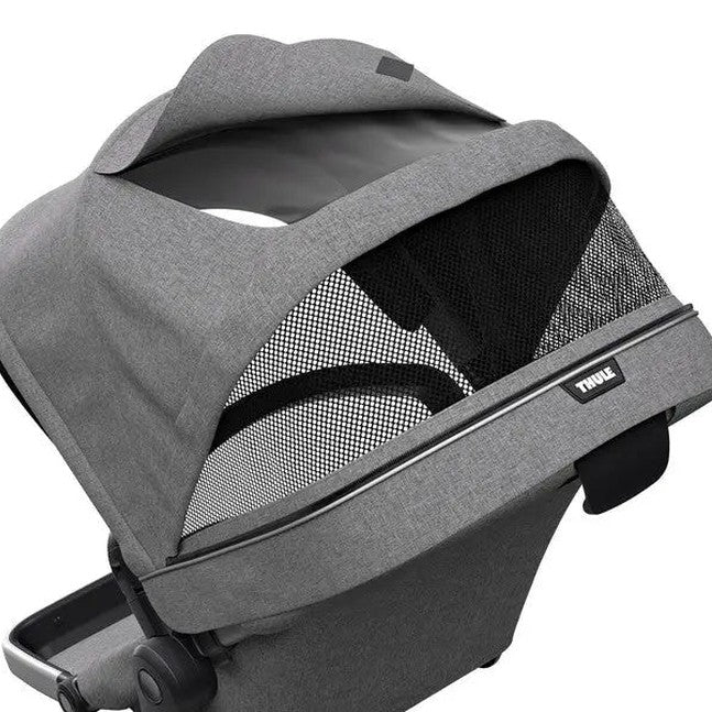 Thule Sleek Sibling Seat in grey fabric with mesh panels mounted on a stroller, showing secure fit