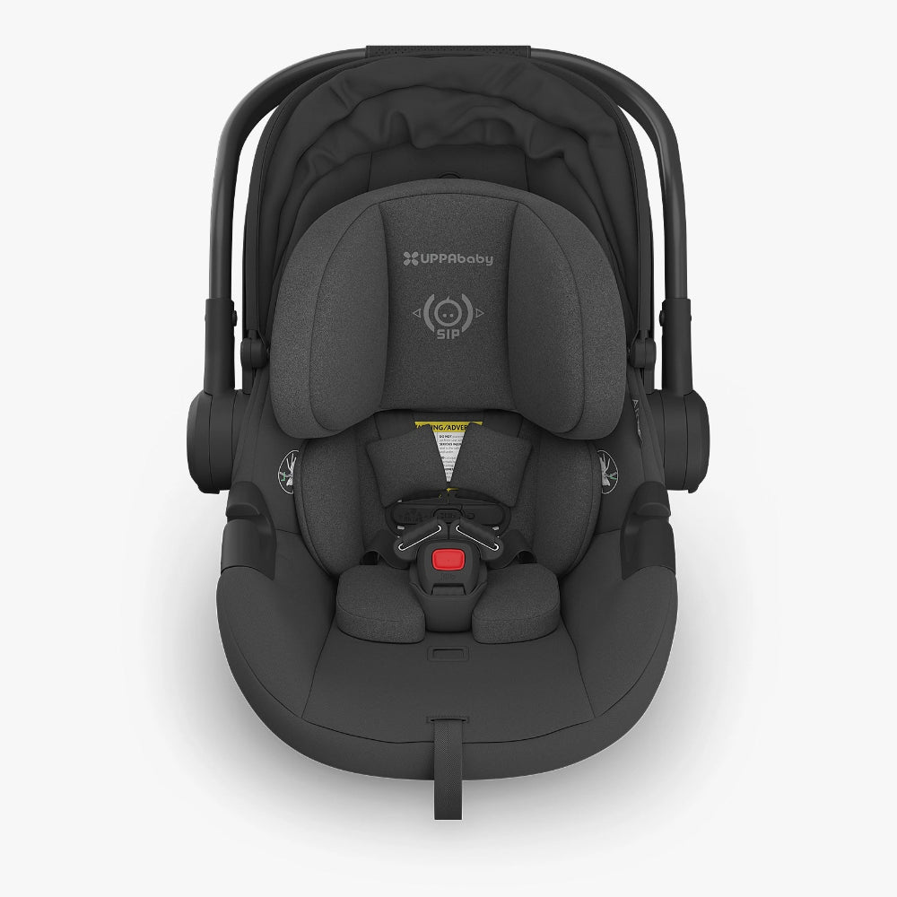 Uppababy Aria Car Seat in dark gray, five-point harness fastened with red buckle.