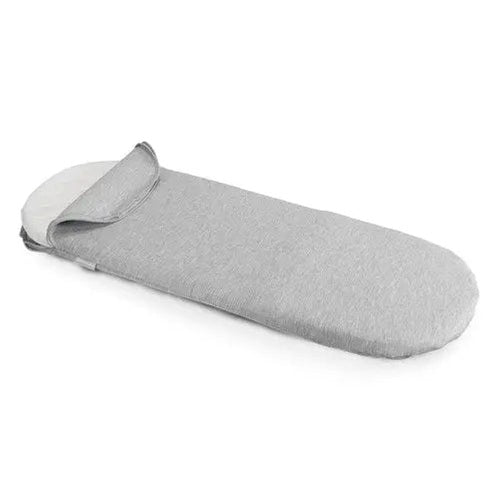 Uppababy Bassinest Mattress Cover in grey fabric being slipped over a bassinet mattress for 2018+ models.