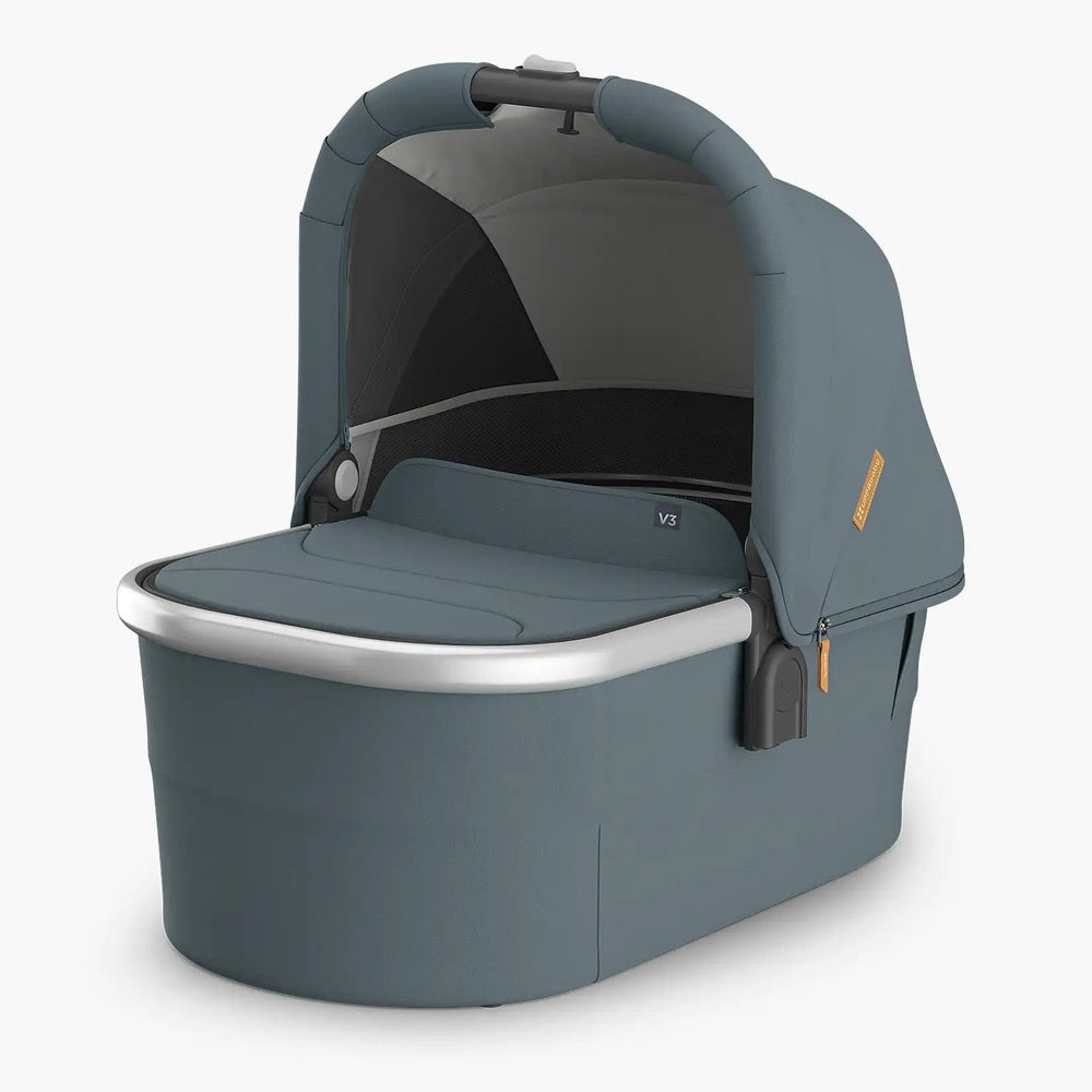 Uppababy Bassinet V3 in blue-gray, canopy sheltering a spacious bassinet with a silver rim.
