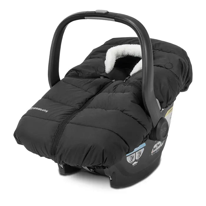 Uppababy Cozyganoosh for Mesa/Aria car seat, black quilted cover with white sherpa lining, snugly draped.