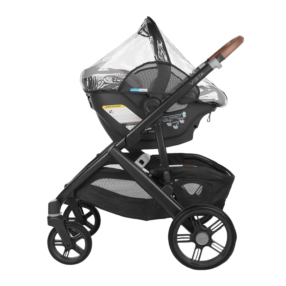 UPPABABY Rain Shield for Aria and Mesa on a black stroller, clear canopy keeping baby dry.