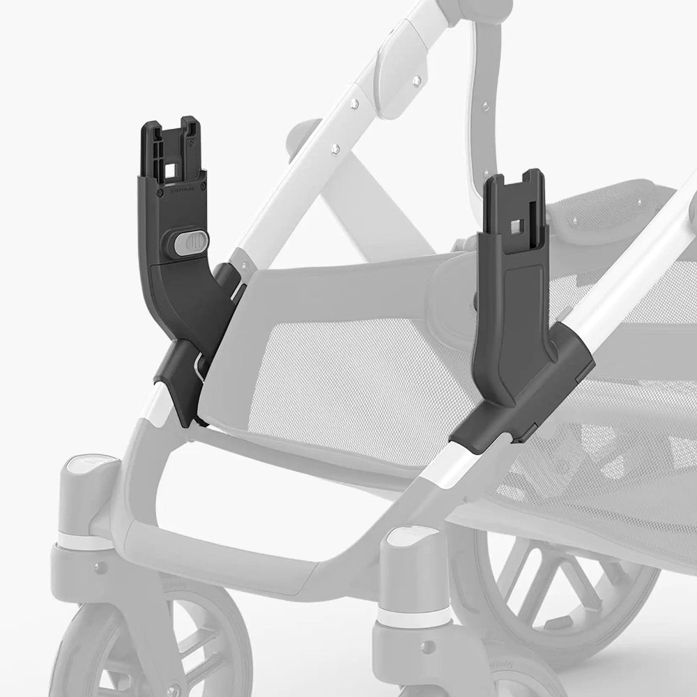 Uppababy Vista Lower Adapter pair in black, clipped to stroller frame for add-ons.