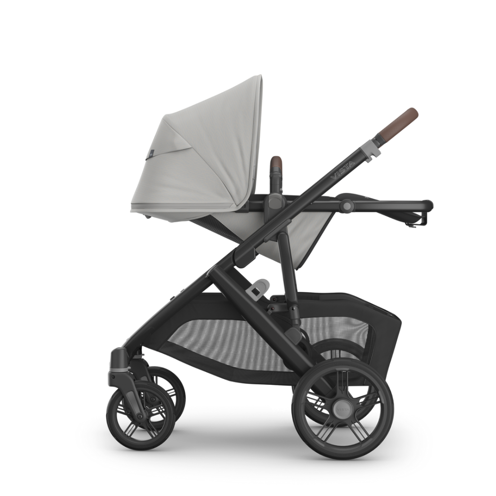 UPPAbaby Vista V3 Stroller in gray fabric with black frame and large rear wheels, storage basket visible.