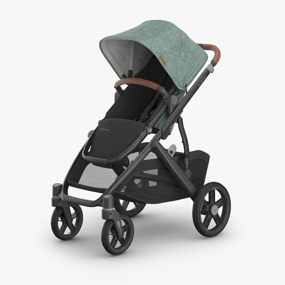 Uppababy Vista V3 Stroller in green canopy with black frame and brown leatherette handlebar.