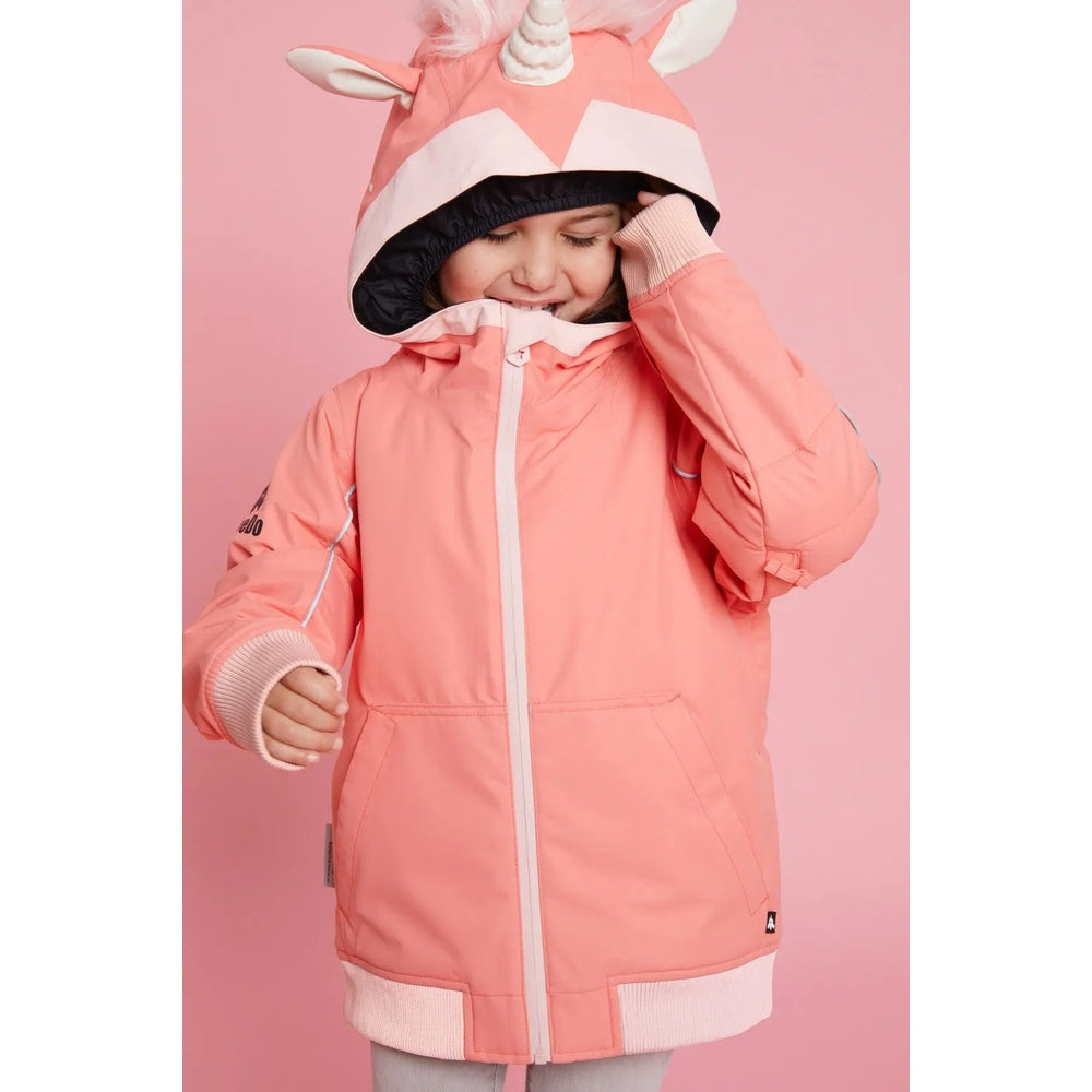 Weedo Unido Unicorn Snow Jacket for kids in coral pink; child adjusts the hood over a white zipper.