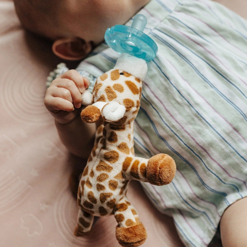 WubbaNub Infant Plush Toy Pacifier Giraffe by Aurora, soft giraffe plush holding a blue pacifier attached for soothing.