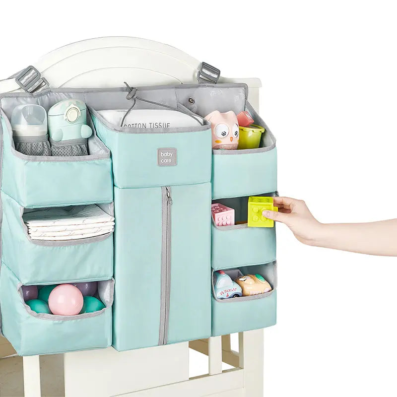 Baby storage organizer hanging bag in turquoise with multiple pockets