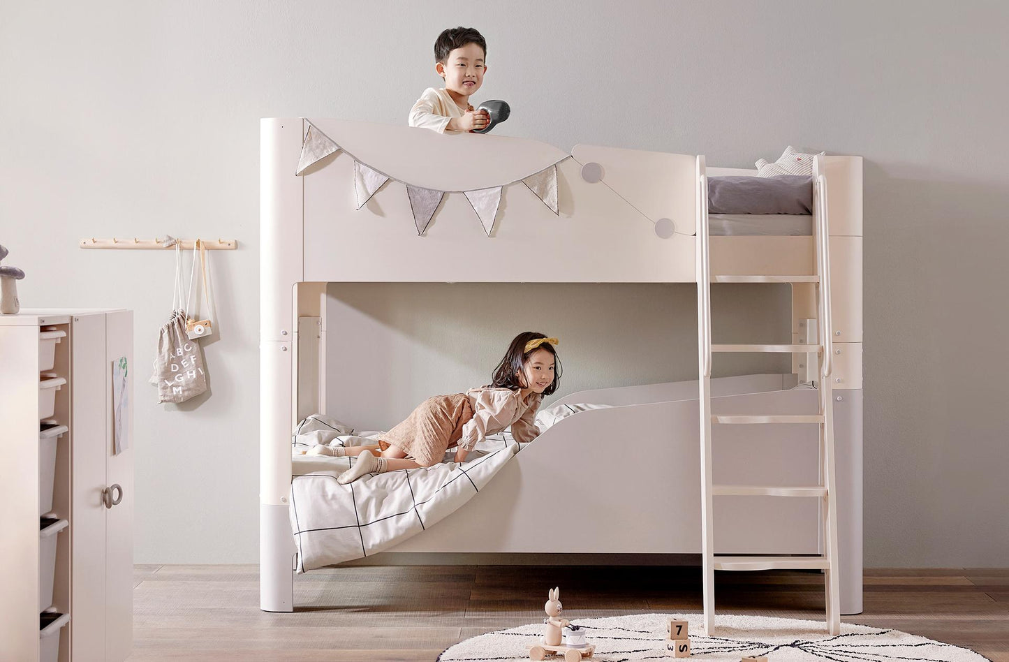 Iloom Coco Kids Spring Mattress 1000W S5G2A on white bunk bed with gray bedding