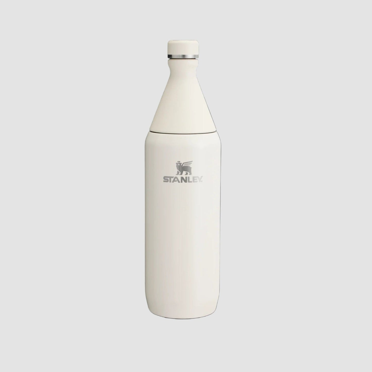 Stanley All Day Slim Bottle 34oz in ivory, stainless steel finish with screw-top cap visible.