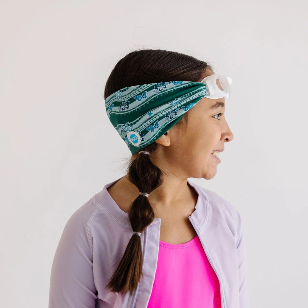 Splash swim goggles turtle turnpike on girl with green patterned headband
