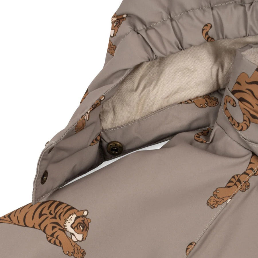 Konges Slojd Mismou Jacket Tiger Oak, beige tiger-print puffer with front snap buttons visible on a panel.