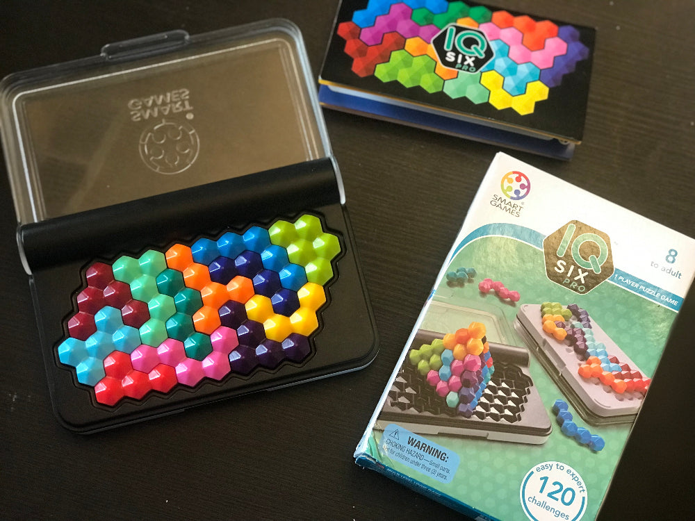 Smart Games IQ Six Pro puzzle game in black case with multicolor hex tiles