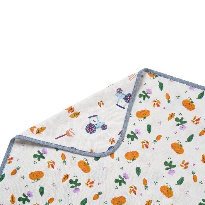 Nest Designs cotton waterproof baby change pad, harvest time pattern with pumpkins and leaves.