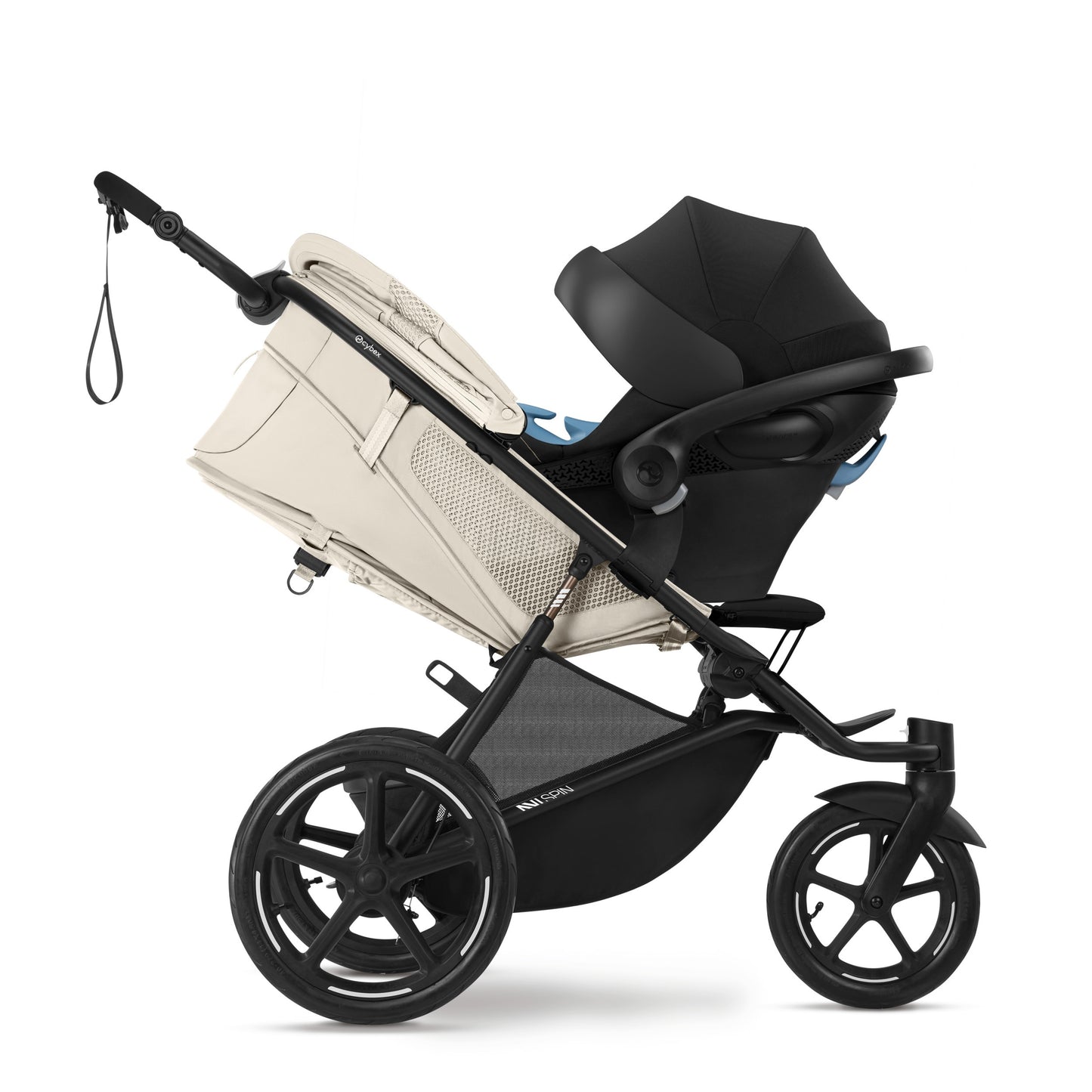 Cybex Avi Spin All Terrain Stroller with beige bassinet attached and black seat, rugged wheels ready for outdoors