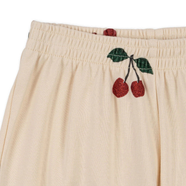 Konges Slojd Malli Glitter Pants in cream with glitter cherry embroidery at elastic waistband.