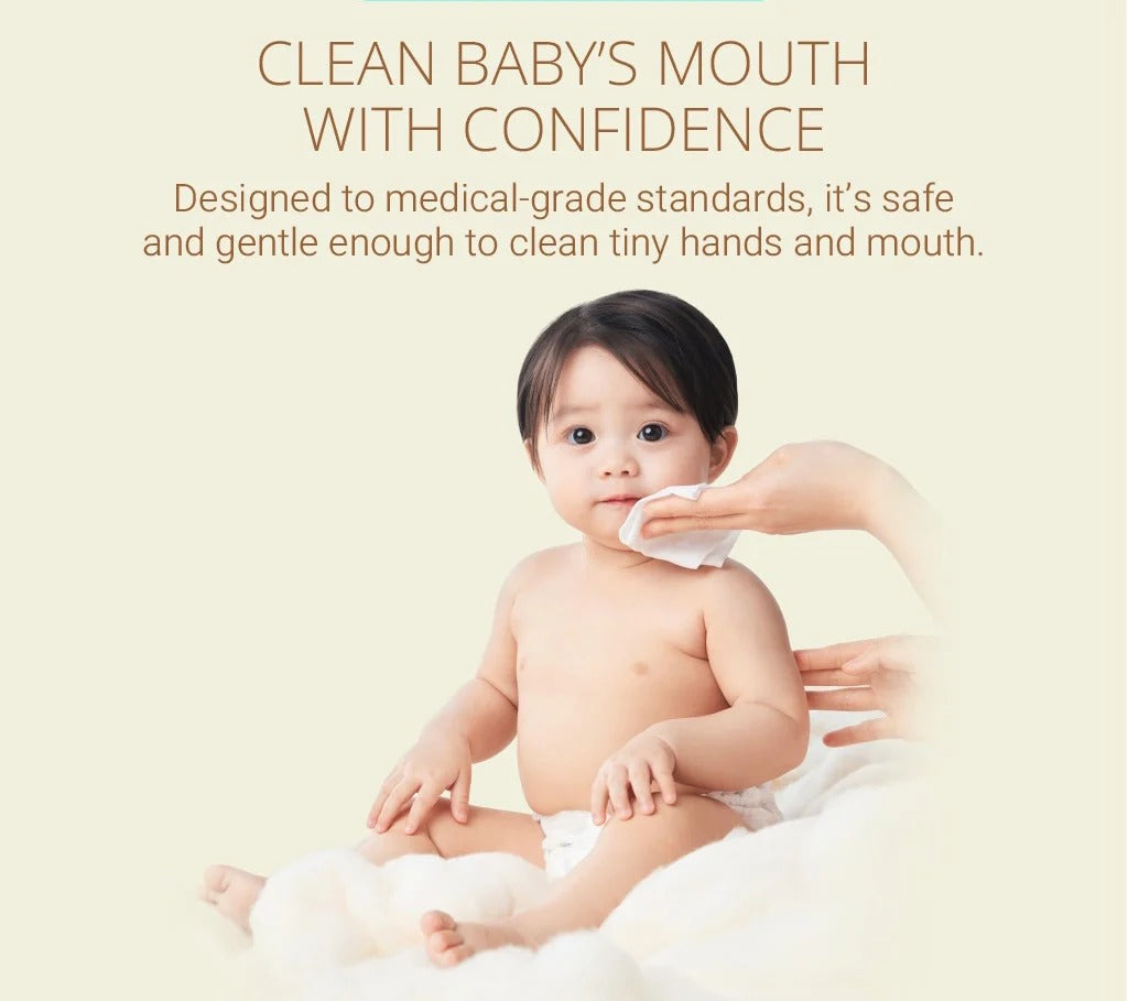 Purcotton Cotton Baby Wet Wipes 20 Sheets; a caregiver gently wipes the baby's mouth with a wipe.