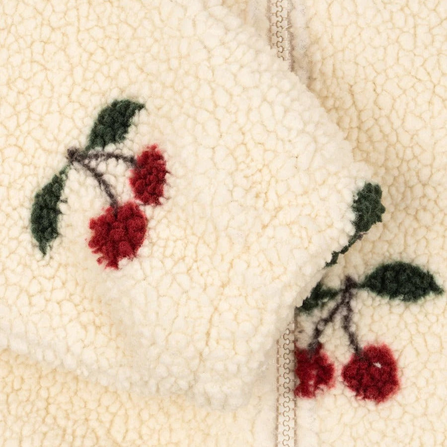 Konges Slojd Jody Teddy Jacket Ma Grande Cerise in cream sherpa with cherry embroidery, front zipper shown.