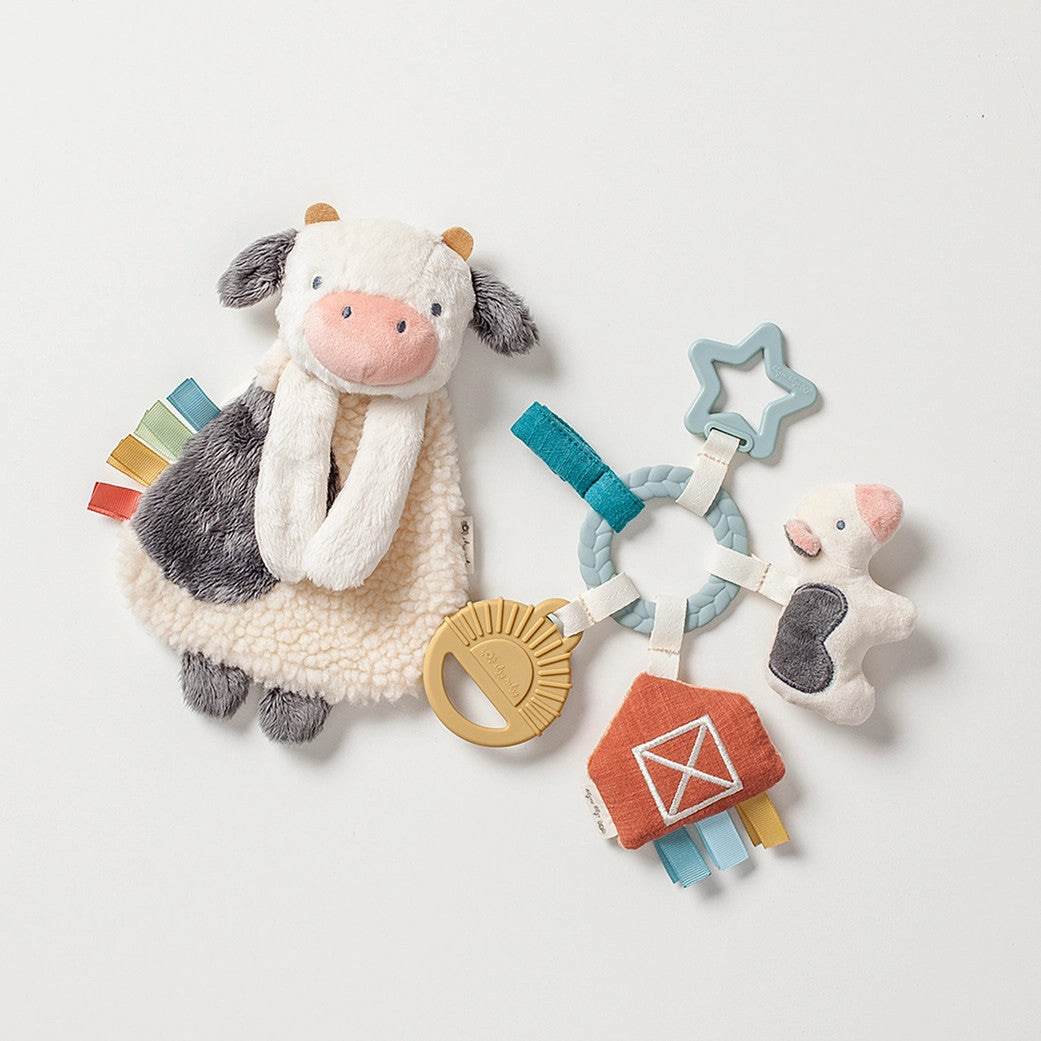 Itzy Ritzy Bitzy Busy Gift Set plush cow with star teether and colorful ribbons