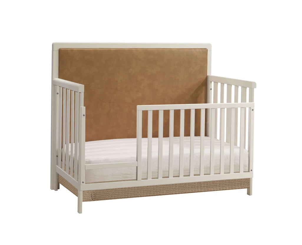 Natart Kyoto toddler bed with white frame and tan upholstered headboard