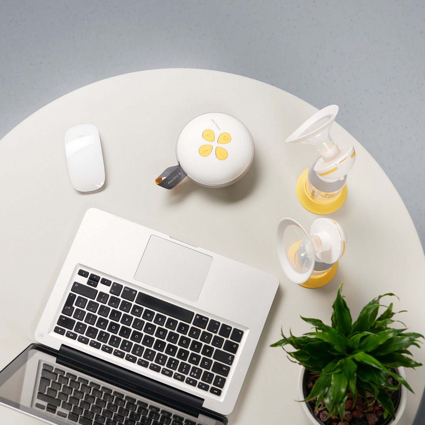 Medela Swing Maxi double electric breast pump with yellow accents