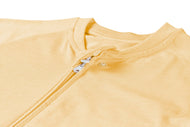 NEST DESIGNS BAMBOO JERSEY SHORT SLEEVE FOOTED SLEEP BAG 0.5 TOG - PANTONE SUNSET GOLD