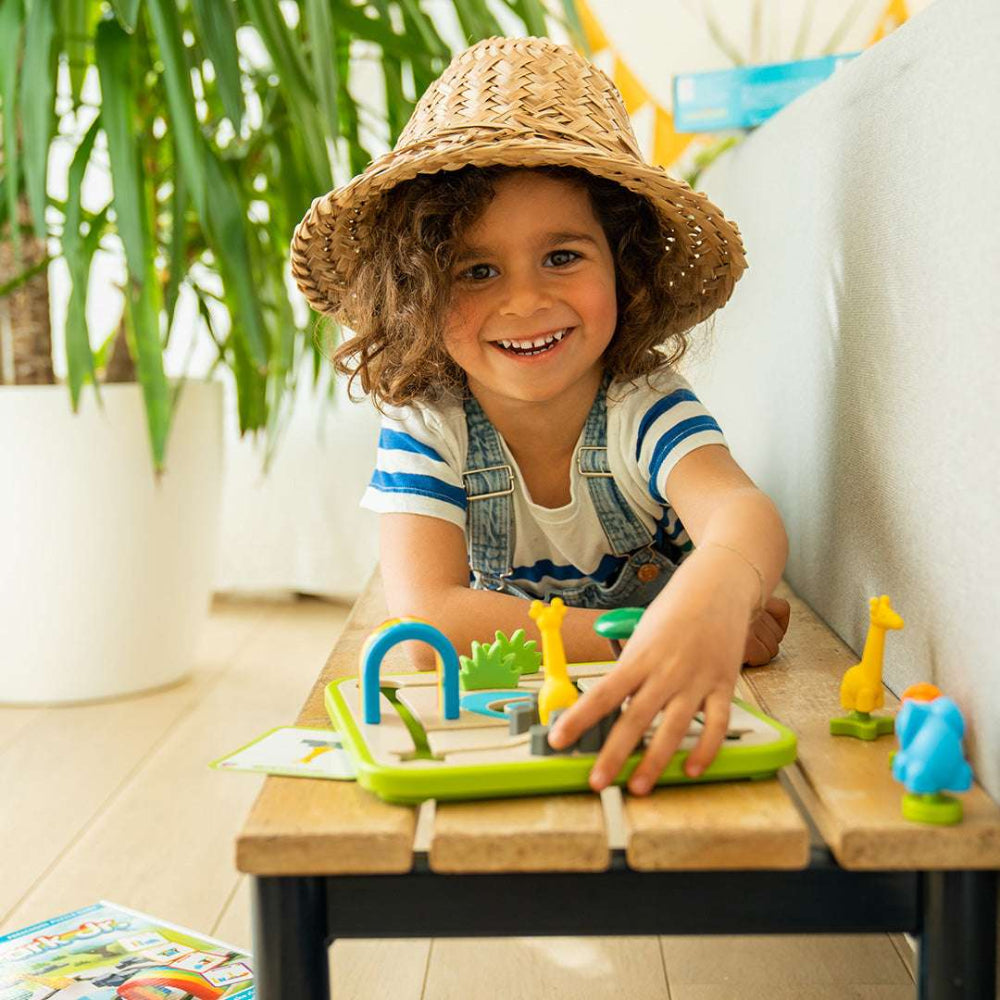 Smart Games Safari Park Jr. game with green board and yellow animal pieces