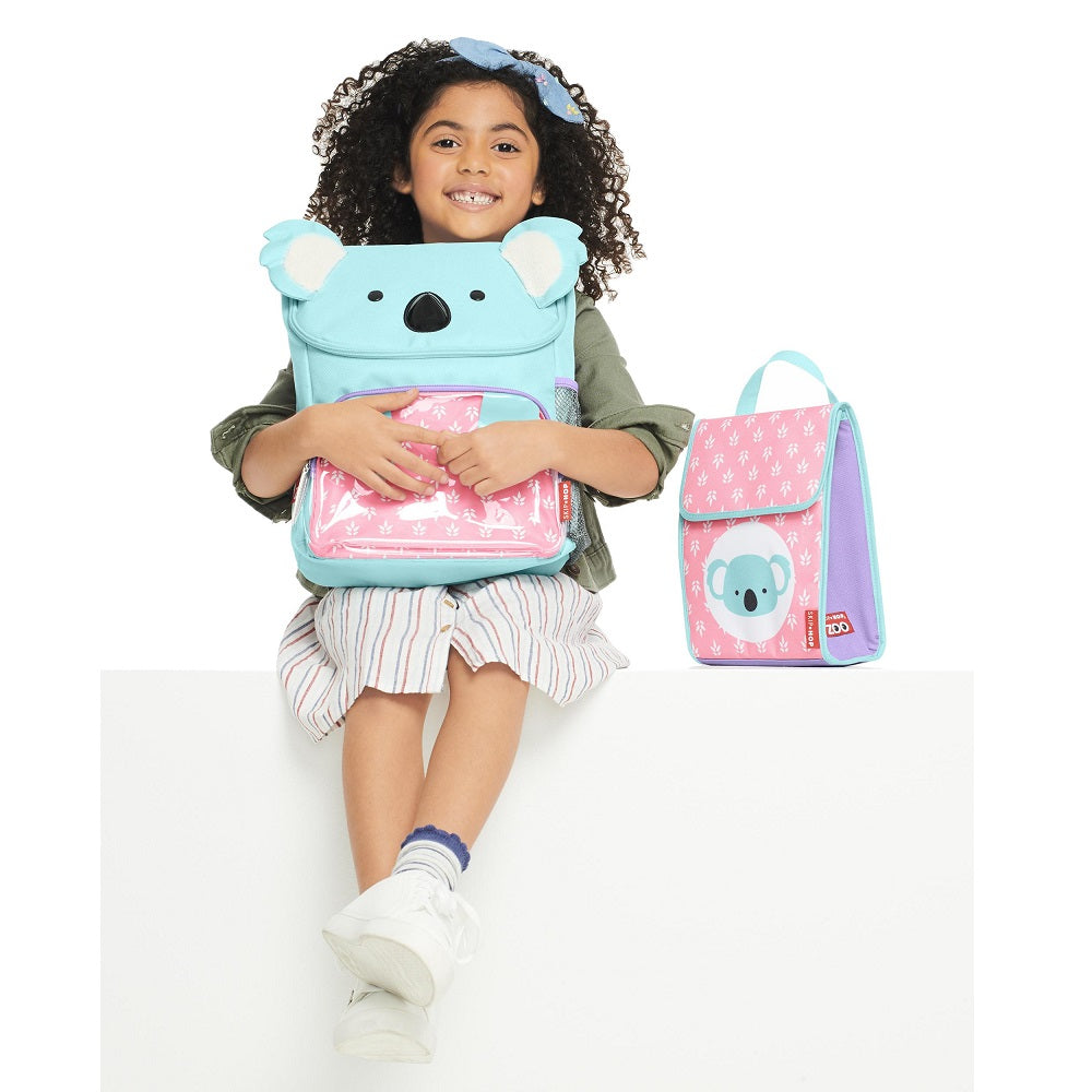 Skip Hop Zoo Big Kid Backpack Koala blue with ears; child sits with pink koala lunch bag