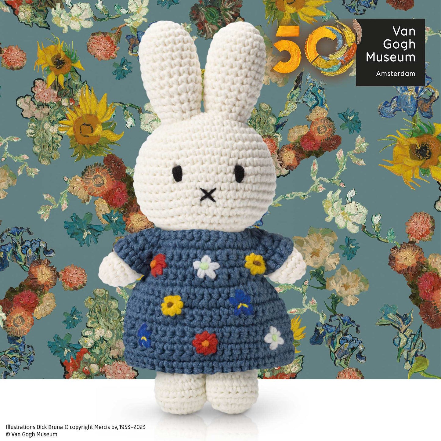 Miffy crochet bunny in blue dress with multicolored flowers