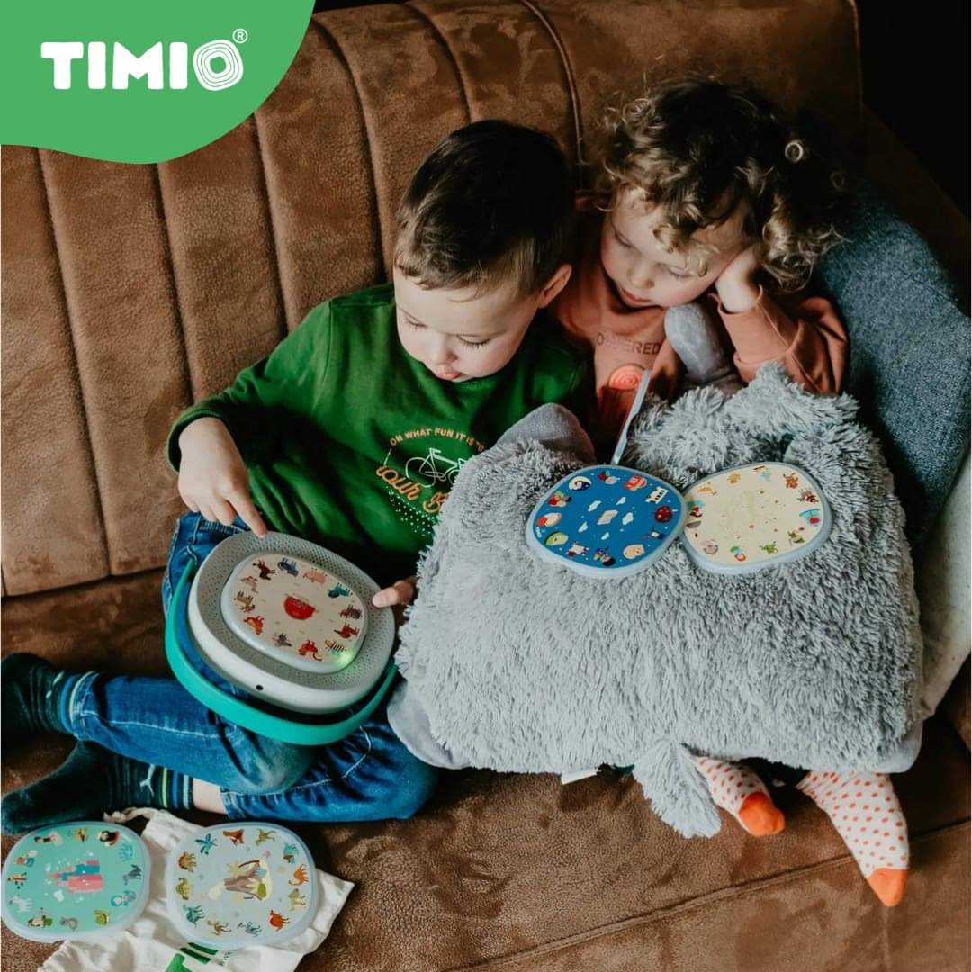 Timio player starter kit with gray plush elephant and round patterned discs