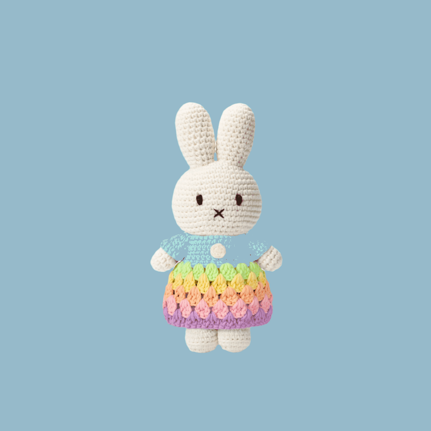 Miffy amigurumi bunny wearing a rainbow crochet dress with blue top